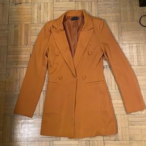 Orange earth tone blazer.